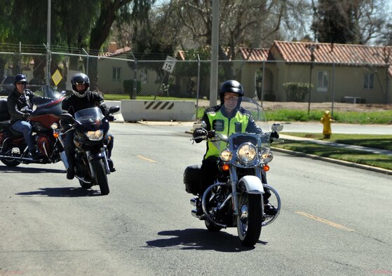 Maj. Gen. Eric W. Crabtree, commander, 4th Air Force, departs from the 4th Air Force Headquarters building parking lot with fellow 4th Air Force motorcycle riders at the beginning of a farewell ride at March Air Reserve Base, Calif., March 9, 2011.  Members of 4th Air Force organized the ride as a way to say goodbye to General Crabtree, who will be taking a new assignment at the Defense Threat Reduction Agency, Ft. Belvoir, Va. 