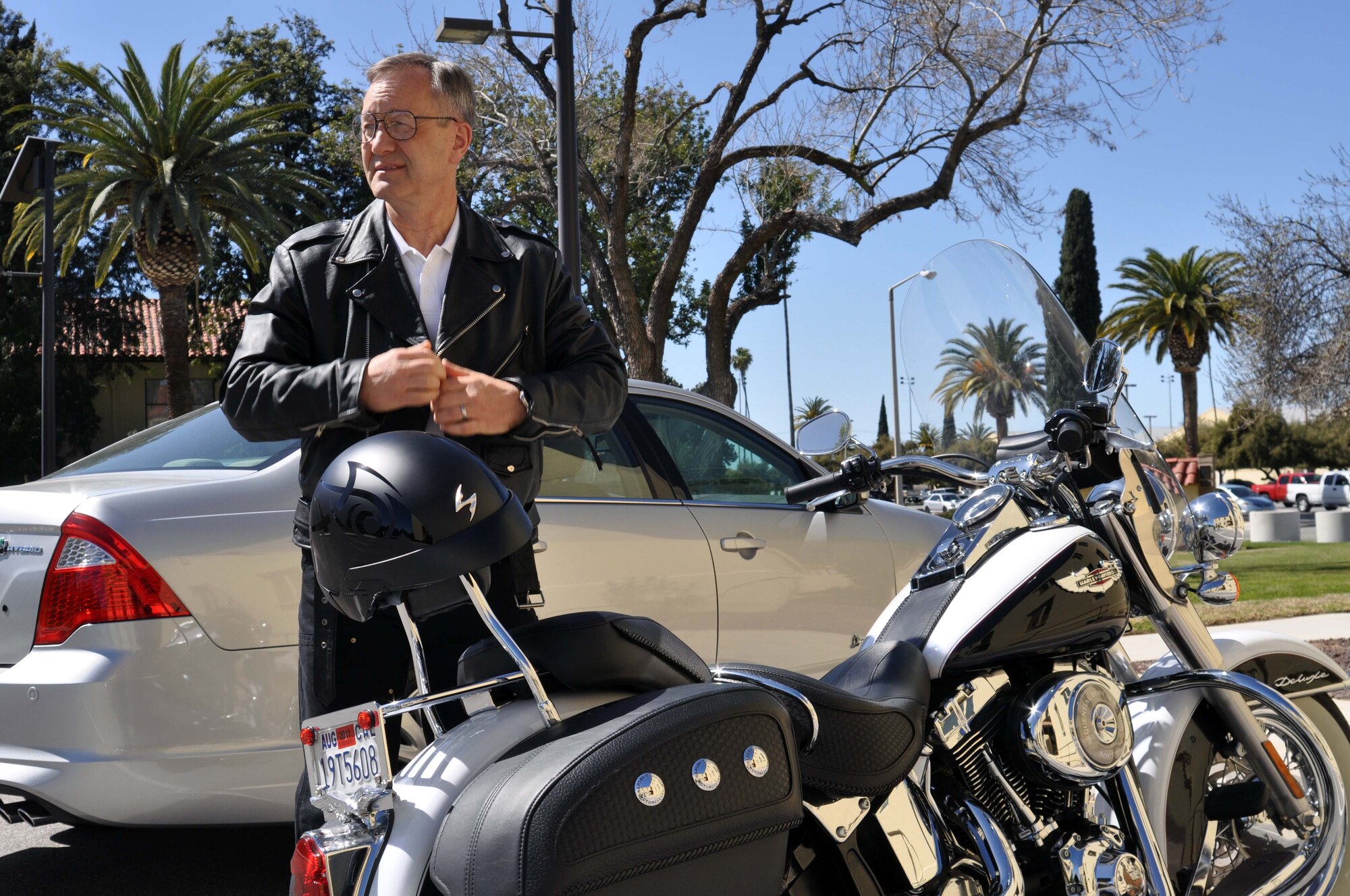 Maj. Gen. Eric W. Crabtree, commander, 4th Air Force, dons his leather jacket prior to a farewell motorcycle ride at March Air Reserve Base, Calif., March 9, 2011.  Members of 4th Air Force organized the ride as a way to say goodbye to General Crabtree, who will be taking a new assignment at the Defense Threat Reduction Agency, Ft. Belvoir, Va. 