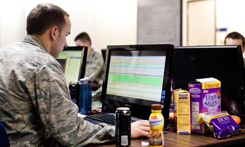 Cadet 2nd Class Jordan Keefer checks the status of the Air Force Academy's network during a National Collegiate Cyber Defense "At Large" regional competition at the Air Force Academy March 6, 2011. The Academy took first place at the contest and will compete at the national level in San Antonio April 8-10. Cadet Keefer is assigned to Cadet Squadron 37. (courtesy photo/Jeff Scaparra)