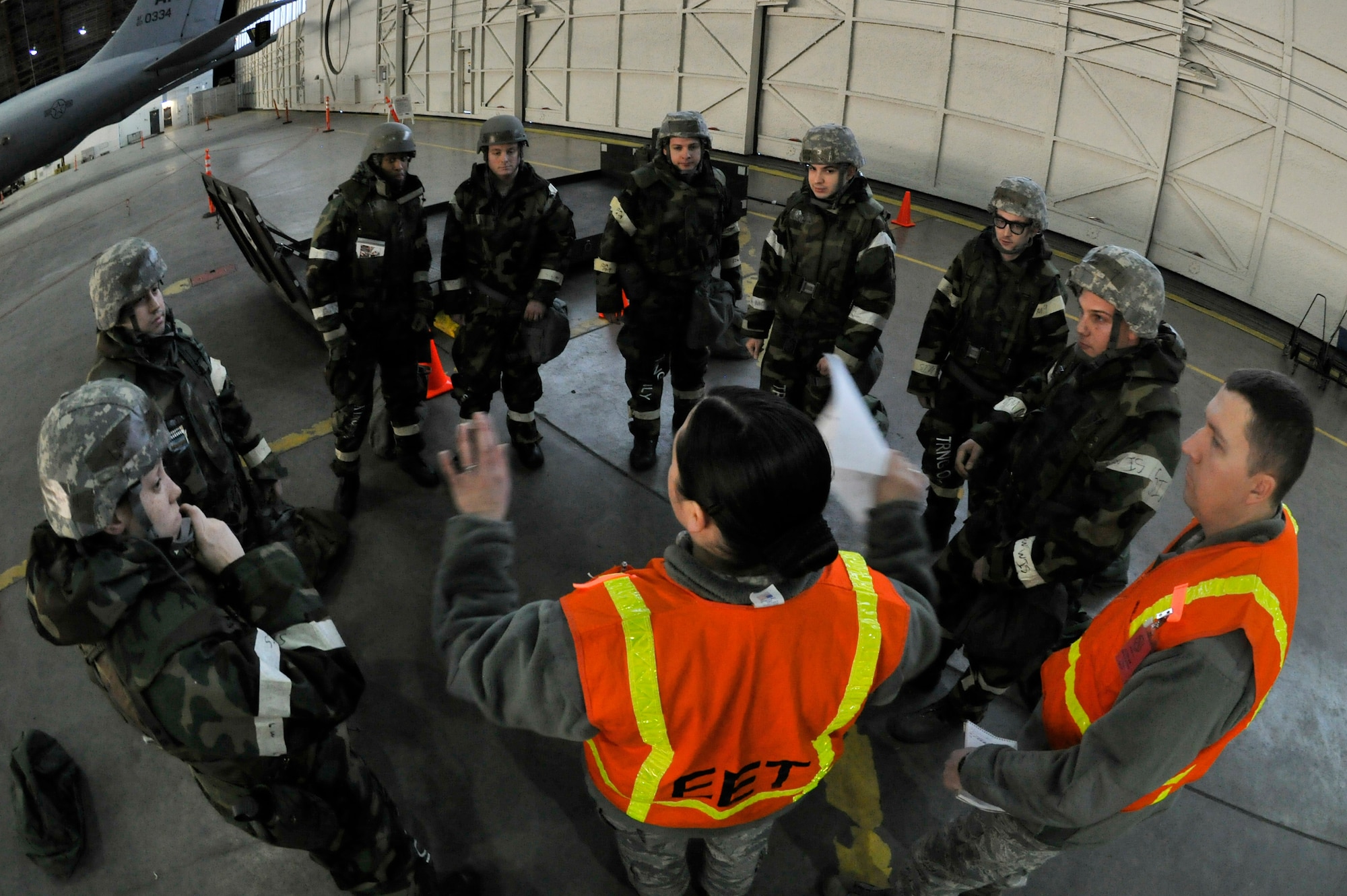 Evaluators provide instruction to Airmen during an operational readiness exercise evaluation March 10, 2011 Eielson Air Force Base, Alaska. The evaluation tests the ability of Airmen on how to survive and operate in a chemical, biological, radiological, nuclear and high yield explosive environment. (U.S. Air Force photo/Staff Sgt. Christopher Boitz)