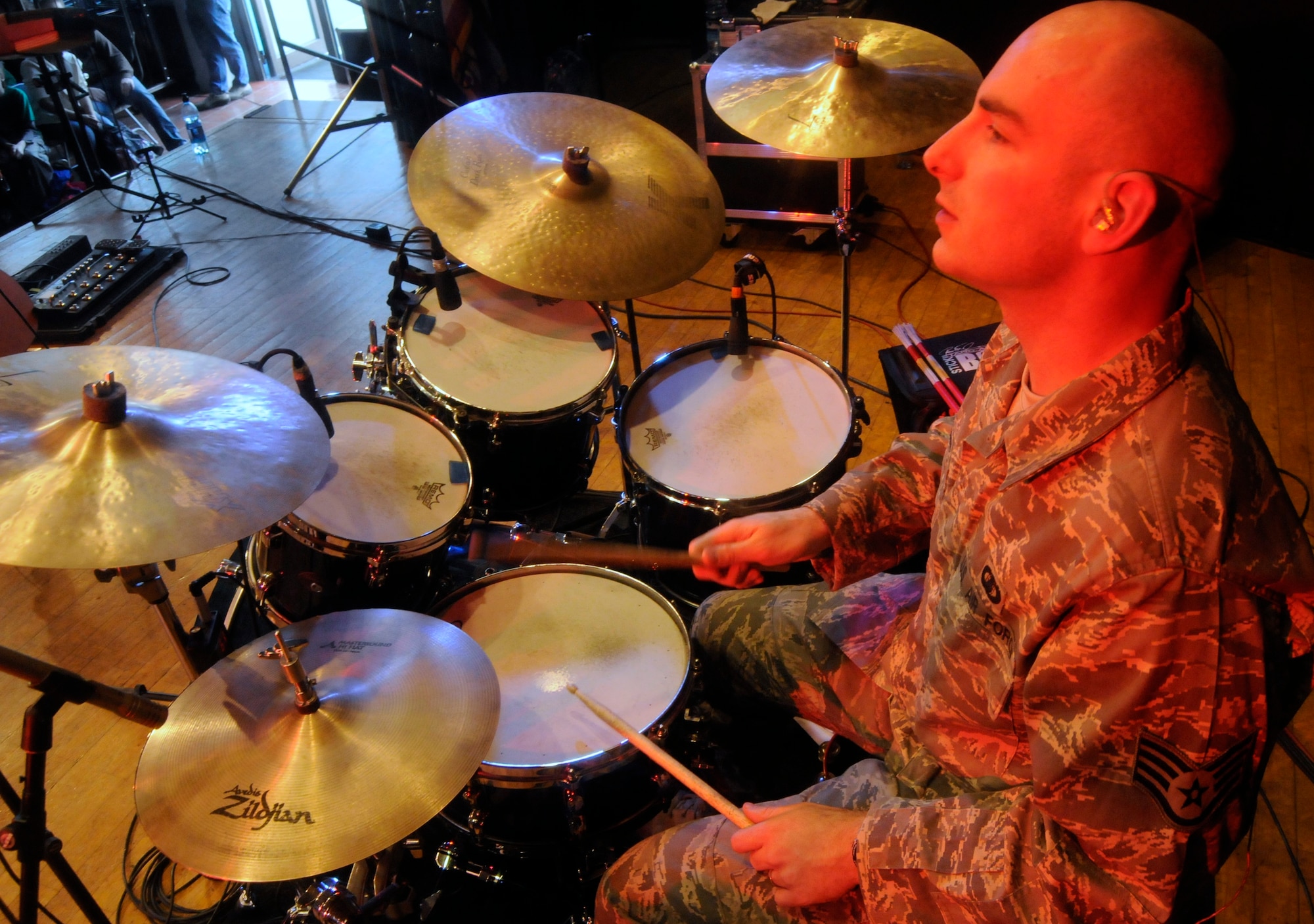 ANSBACH, Germany – Staff Sgt. Jon Friedman, U.S. Air Forces in Europe Band Touch ‘n Go percussionist, performs for Ansbach Middle and High School students on U.S. Army Garrison Ansbach, Germany, during a performance March 9. Touch ‘n Go performed before a packed gymnasium of students and teachers at the school as part of a Music in Our Schools tour throughout Bavaria. (U.S. Air Force photo/Staff Sgt. Kali L. Gradishar)