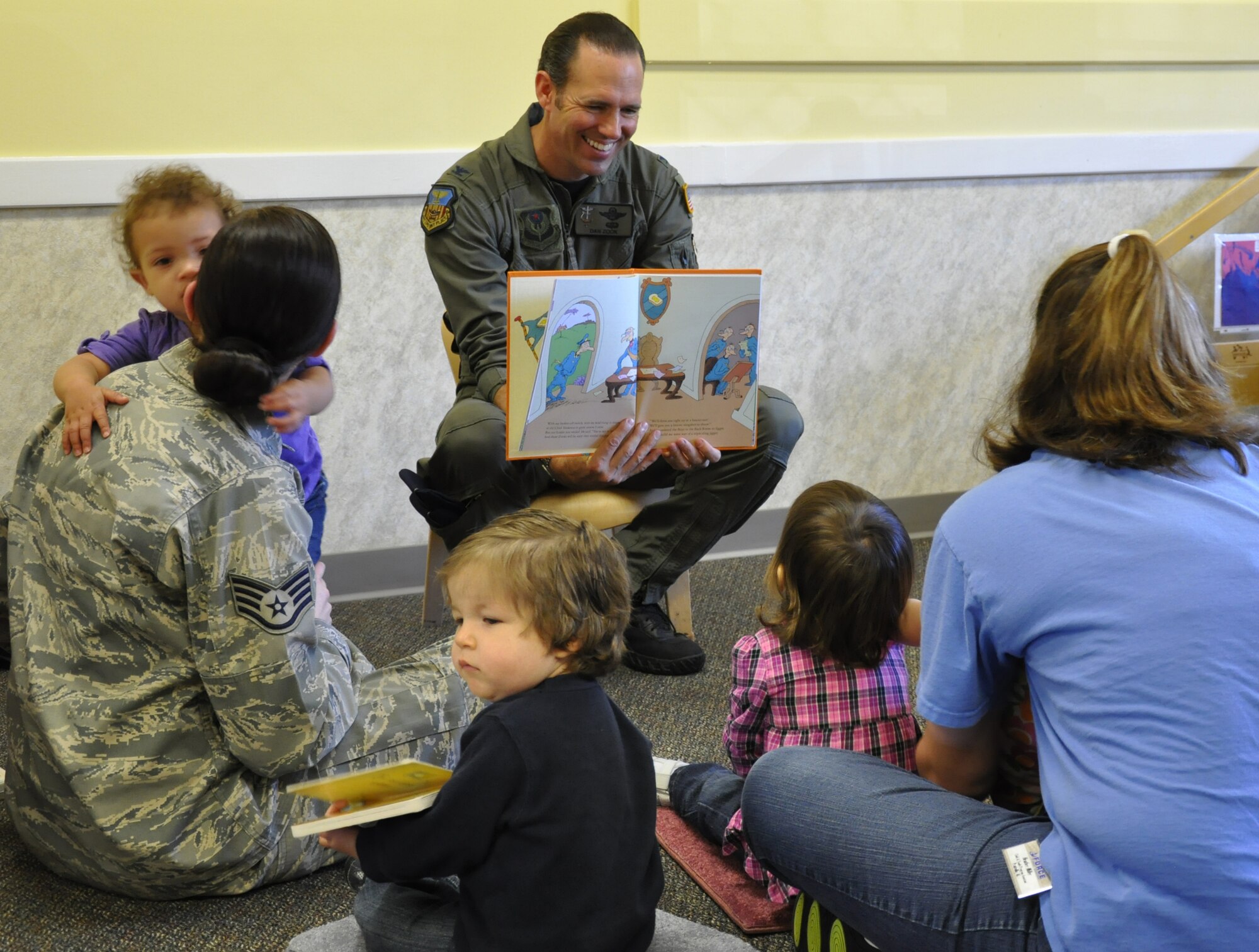 Col. Daniel Zook, 1st Special Operations Wing vice commander, reads from Dr. Seuss' "The Butter Battle Book" to one-year-olds at the Child Development Center at Hurlburt Field, Fla., March 10, 2011. The event was part of the CDC's Literary Appreciation Week. (U.S. Air Force photo by Senior Airman Joe McFadden / RELEASED)