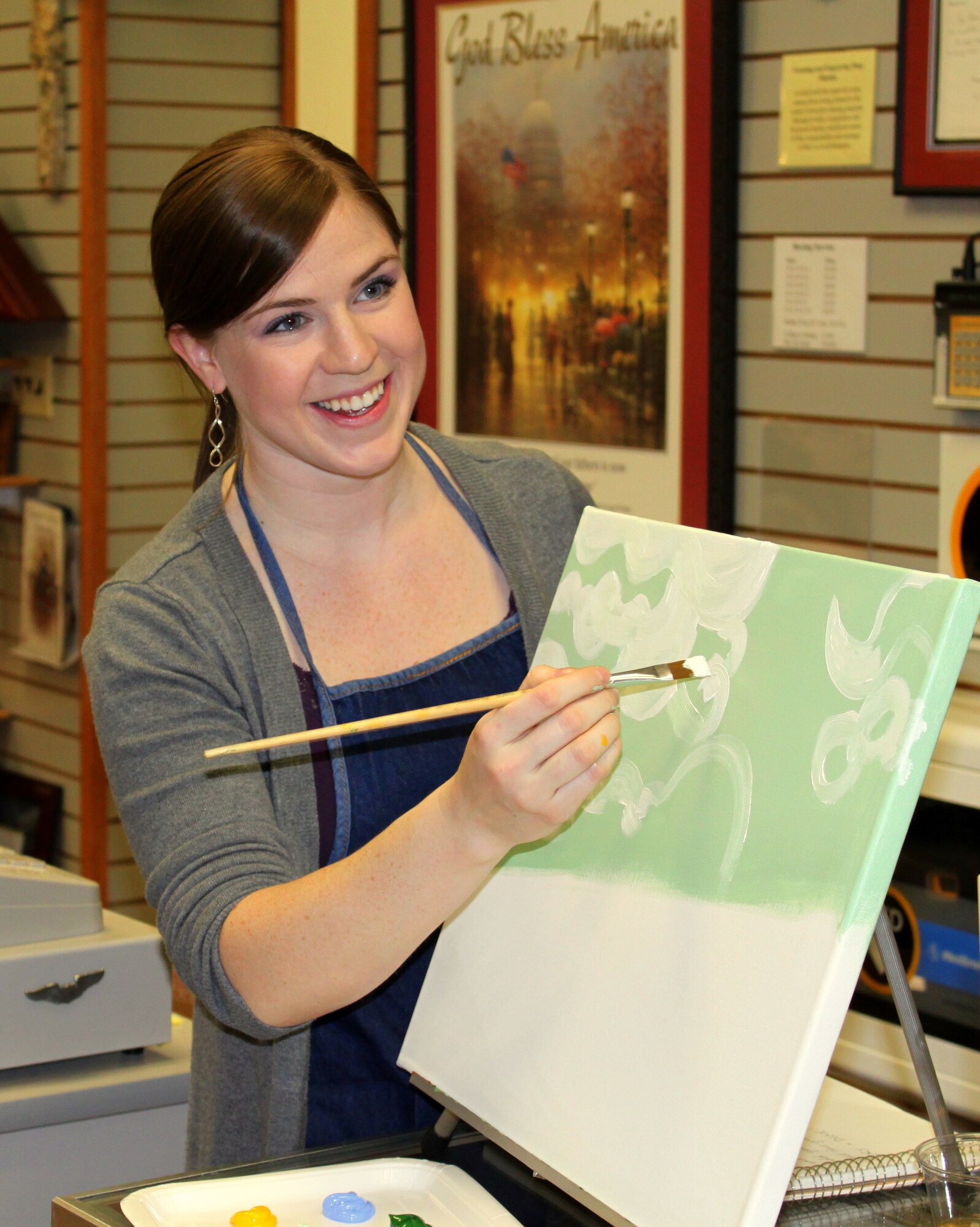 LAUGHLIN AIR FORCE BASE, Texas-Marie Martelly, Frame and Woodcraft shop picture framer, instructs an iCANvas Paint! class at Laughlin’s Frame and Woodcraft shop. iCANvas Paint! is a three hour painting class that provides all the materials needed to walk out of the door with a personal work of art. (Contributed photo)