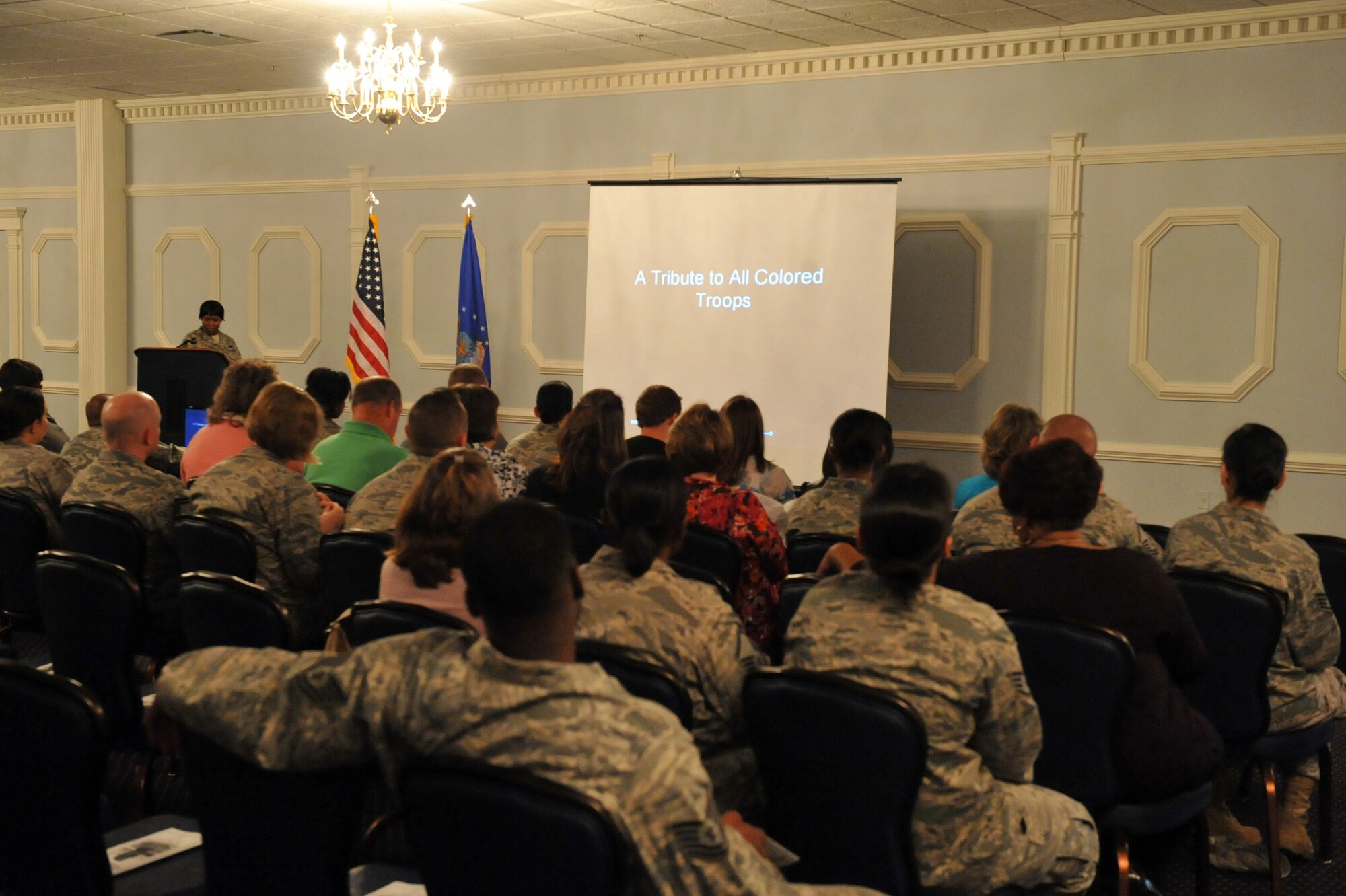 SEYMOUR JOHNSON AIR FORCE BASE, N.C. -- Audience members view a slideshow during the African American Heritage Celebration Finale here, March 9, 2011. The slideshow was shown to highlight how African Americans hoped for change and believed a time would come when the color of their skin did not matter. (U.S. Air Force photo/Senior Airman Whitney Lambert)(RELEASED)