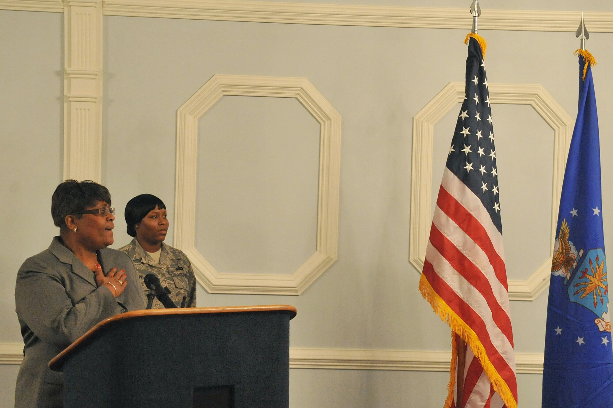 SEYMOUR JOHNSON AIR FORCE BASE, N.C. -- Sylvia Cunningham, 4th Medical Group patient advocate officer, sings the national anthem during the African American Heritage Celebration Finale here, March 9, 2011. Ms. Cunningham has been singing for retirements, change of command ceremonies and special functions here since 2005.
Mrs. Cunningham is a native of Youngstown, Ohio. (U.S. Air Force photo/Senior Airman Whitney Lambert)(RELEASED)
