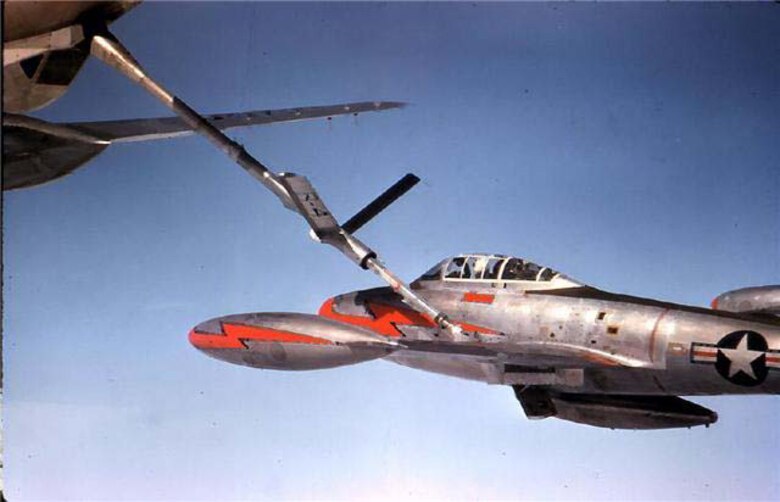 Aerial refueling in 1952, a Republic F-84G of the 77th Fighter BomberSquadron takes on fuel from a propeller-driven Boeing KC-97 Stratotanker.The F-84, which the 20th Fighter Bomber Wing flew for years, was the firstfighter capable of in-flight refueling and nuclear strike. (U.S. Air Forcephoto)