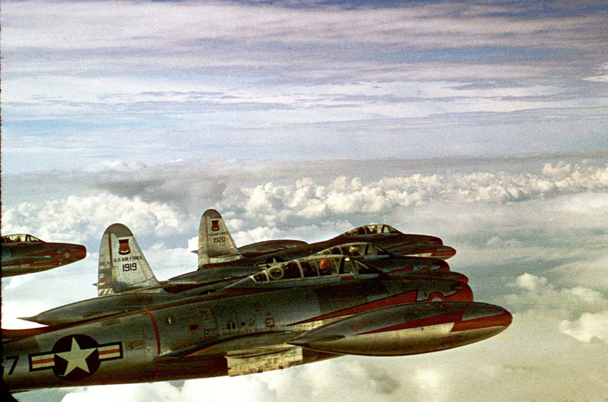 Republic F-84G Thunderjets of the 55th Fighter Bomber Squadron cruise over
the Atlantic Ocean enroute to England in 1952. In a few months, the 20th
Fighter Bomber Wing had developed tactics for a nuclear strike mission, the
first USAF fighter unit to pick up a nuclear role. (U.S. Air Force photo)
