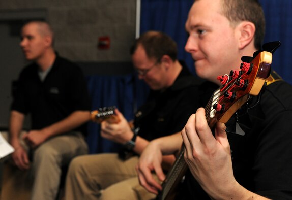 Members of the Air Force Band play as the Outstanding Performers of the Year icebreaker comes to a close at the James H. Rainwater Conference Center in Valdosta, Ga., March 9. The band members played throughout the night as nominees and wing representatives socialized at the event. (U.S. Air Force photo/Airman 1st Class Benjamin Wiseman)(RELEASED)