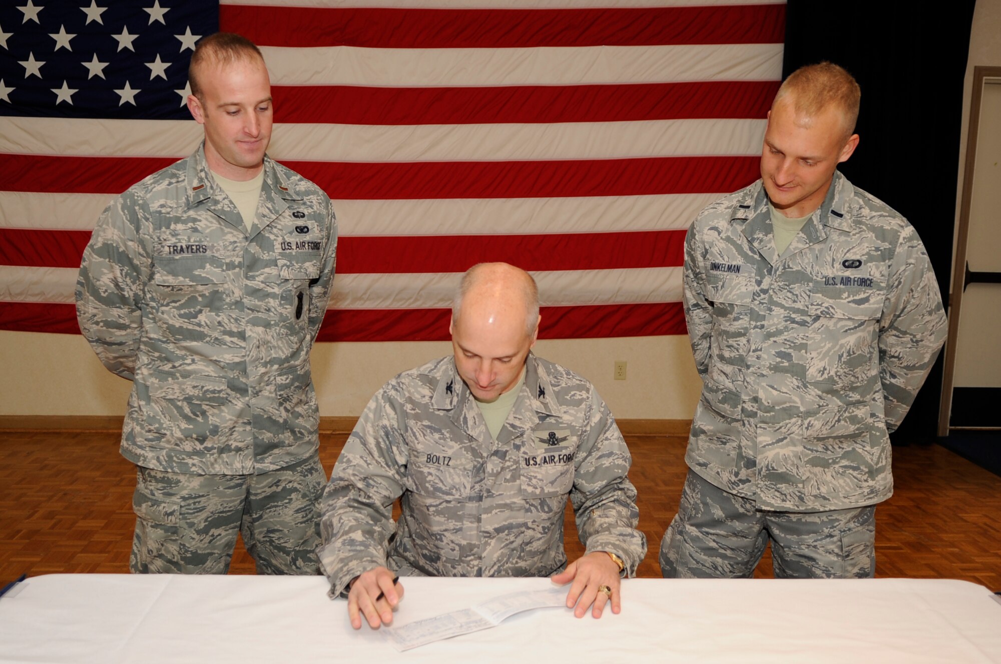 VANDENBERG AIR FORCE BASE, Calif. –Col. Richard Boltz, the 30th Space Wing commander, fills out the first accepted donation form for this year’s Air Force Assistance Fund campaign, which concluded the kick off breakfast at the pacific Coast Club here Thursday, Mar. 10, 2011. The AFAF is a program that supports Airmen and their families who are in need of emergency financial assistance. (U.S. Air Force photo/Senior Airman Lael Huss)
