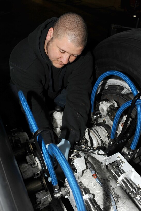 Brandon Simmons, Safety Time Compliance Technical Order team member, puts the finishing touches on a new brake modification for a B-1B Lancer at Ellsworth Air Force Base, S.D., March 2, 2011. The goal is to have all B-1s modified and ready to fly by May 31, 2011. (U.S. Air Force photo/Senior Airman Kasey Close)