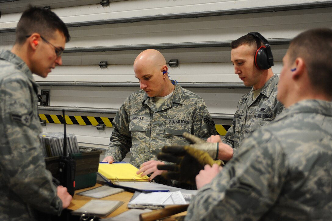 Airmen assigned to the 28th Logistics Readiness Squadron fuels distribution center review tasks before getting started with vehicle inspections at Ellsworth Air Force Base, S.D., March 7, 2011. The fuels distribution center provides fuel for the base and transient aircraft, 24-hours-a-day and seven-days-a-week. (U.S. Air Force photo/Senior Airman Kasey Close)