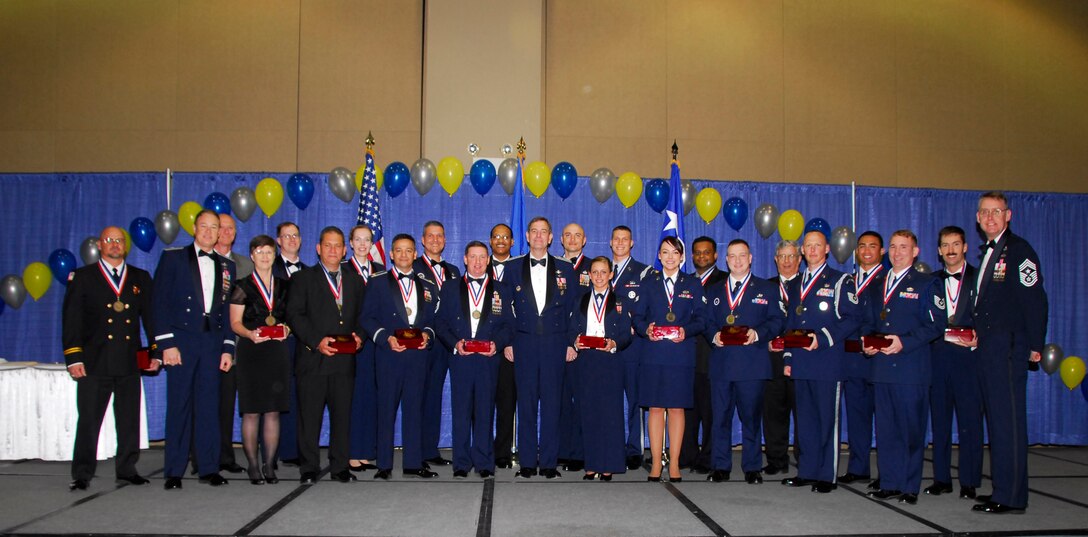 Award winners pose as a group March 4 following the 82nd Training Wing's Annual Awards banquet. The event was in downtown Wichita Falls, Texas, at the Multi-Purpose Events Center. Also pictured with the award winners is Brig. Gen. Darryl Burke, 82nd Training Wing commander (second from left), retired Air Force Gen. Stephen Lorenz (center) and 82nd TRW Command Chief Chief Master Sgt. David Nelson. (U.S. Air Force photo/Harry Tonemah)