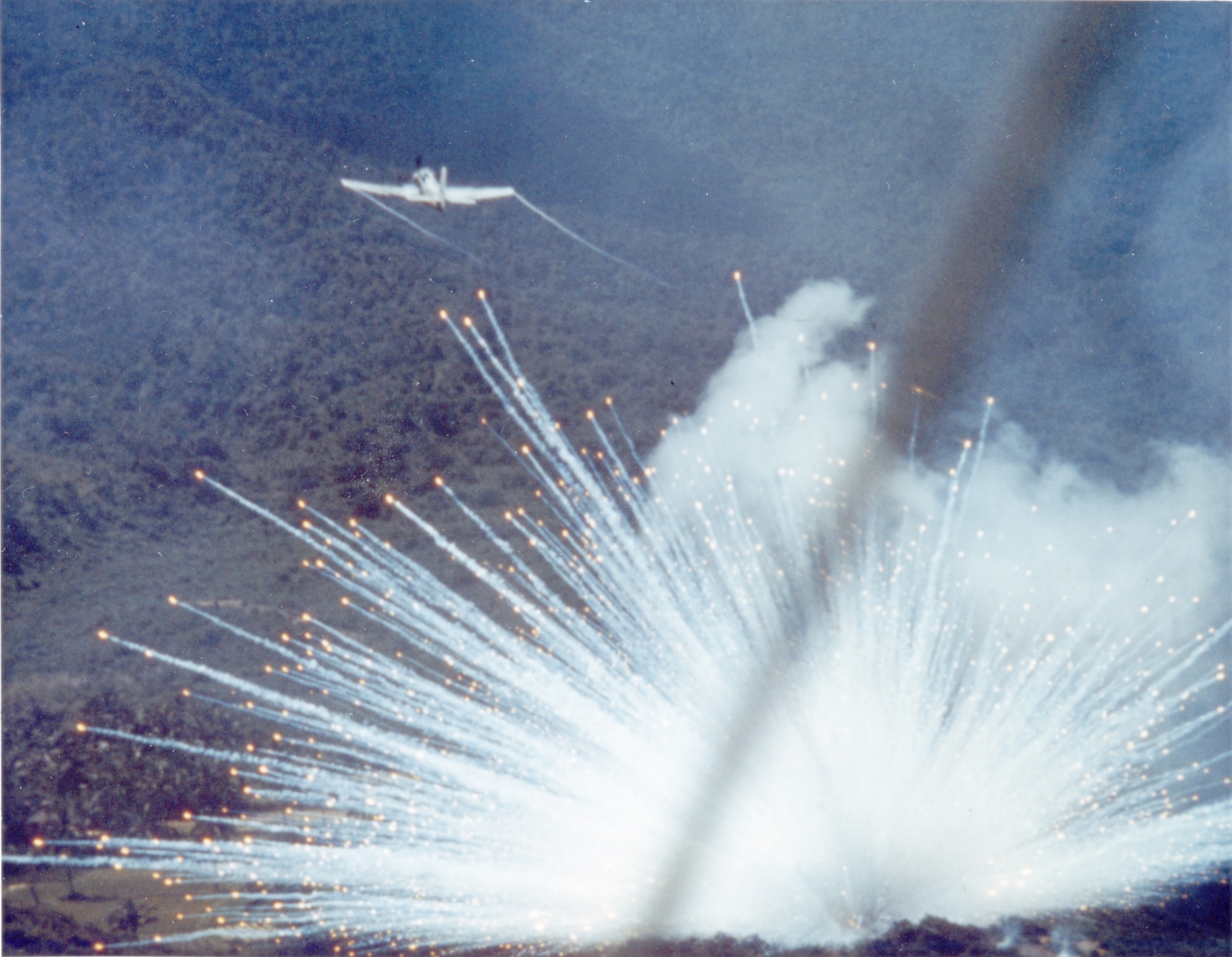 U.S. Air Force aircraft drops a white phosphorus bomb on a Viet Cong postion in 1966. (U.S. Air Force image).