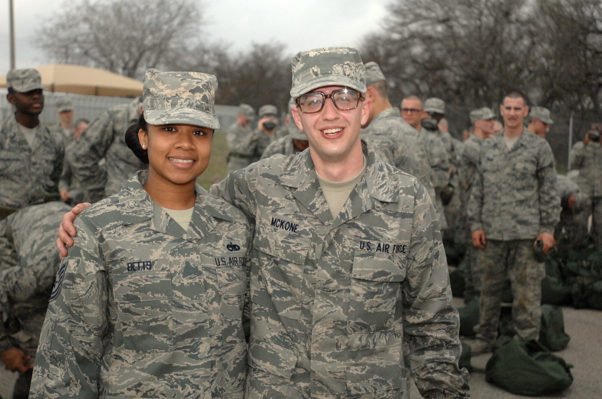 Tech Sgt. Ashli Betts, 334th RCS recruiter and Distinguished Educator Tour noncommissioned officer in charge, finds one of her recruits during a tour of the Basic Military Training Obstacle Course.  Educators from around the country visited Randolph and Lackland AFB to learn about what the Air Force can offer students interested in military service.  (U.S. Air Force photo by Staff Sgt. Hillary Stonemetz)