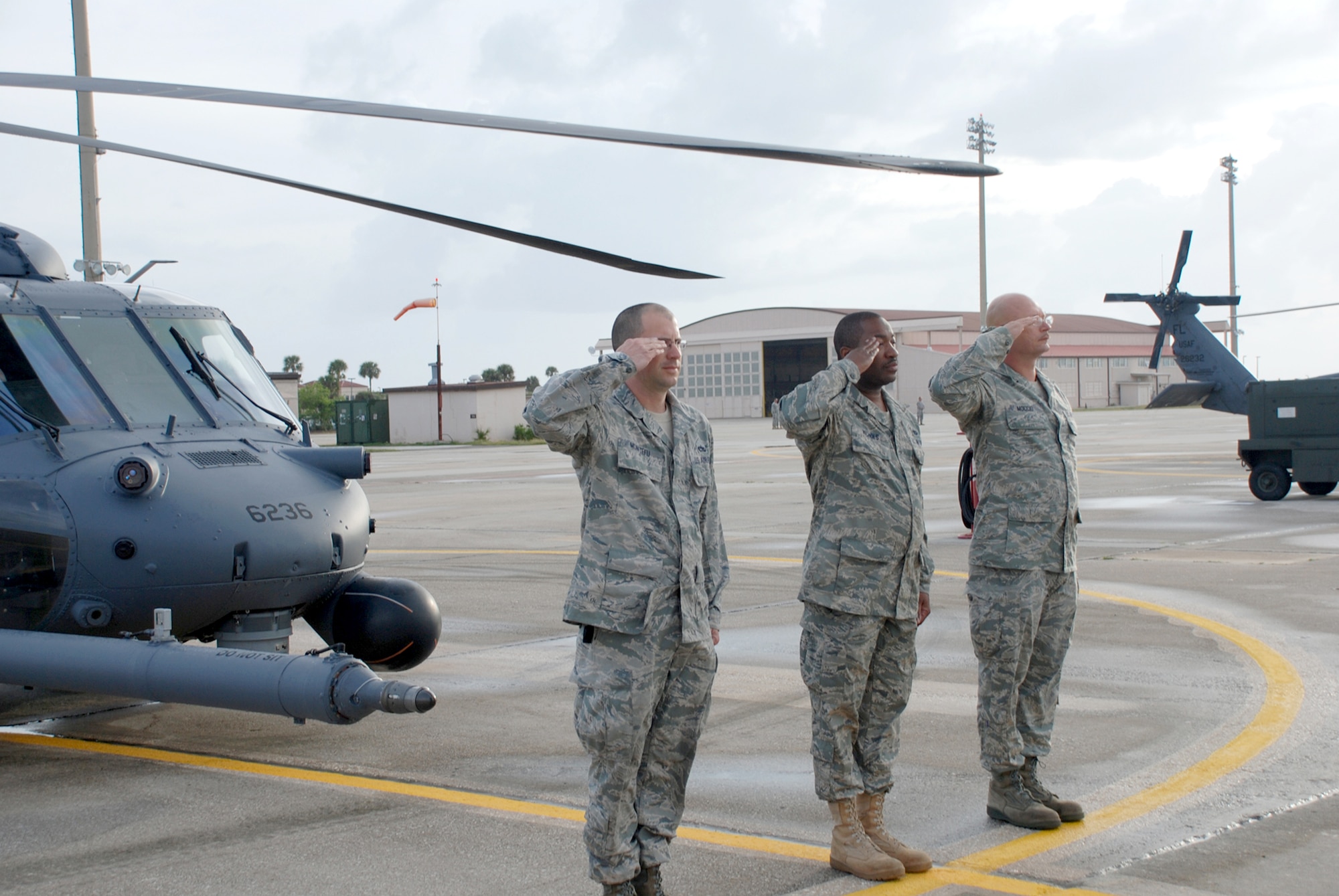 Maintenance crew chiefs from the 920th Rescue Wing present their HH-60G Pave Hawk helicopter during an inspection March 6, 2011, at Patrick Air Force Base, Fla. The 920th RQW commander checked over his entire fleet of six pave hawks and three HC-130 King refuelers, prior to the fleet taking flight. (U.S. Air Force photo/Capt. Ryan Liss) 