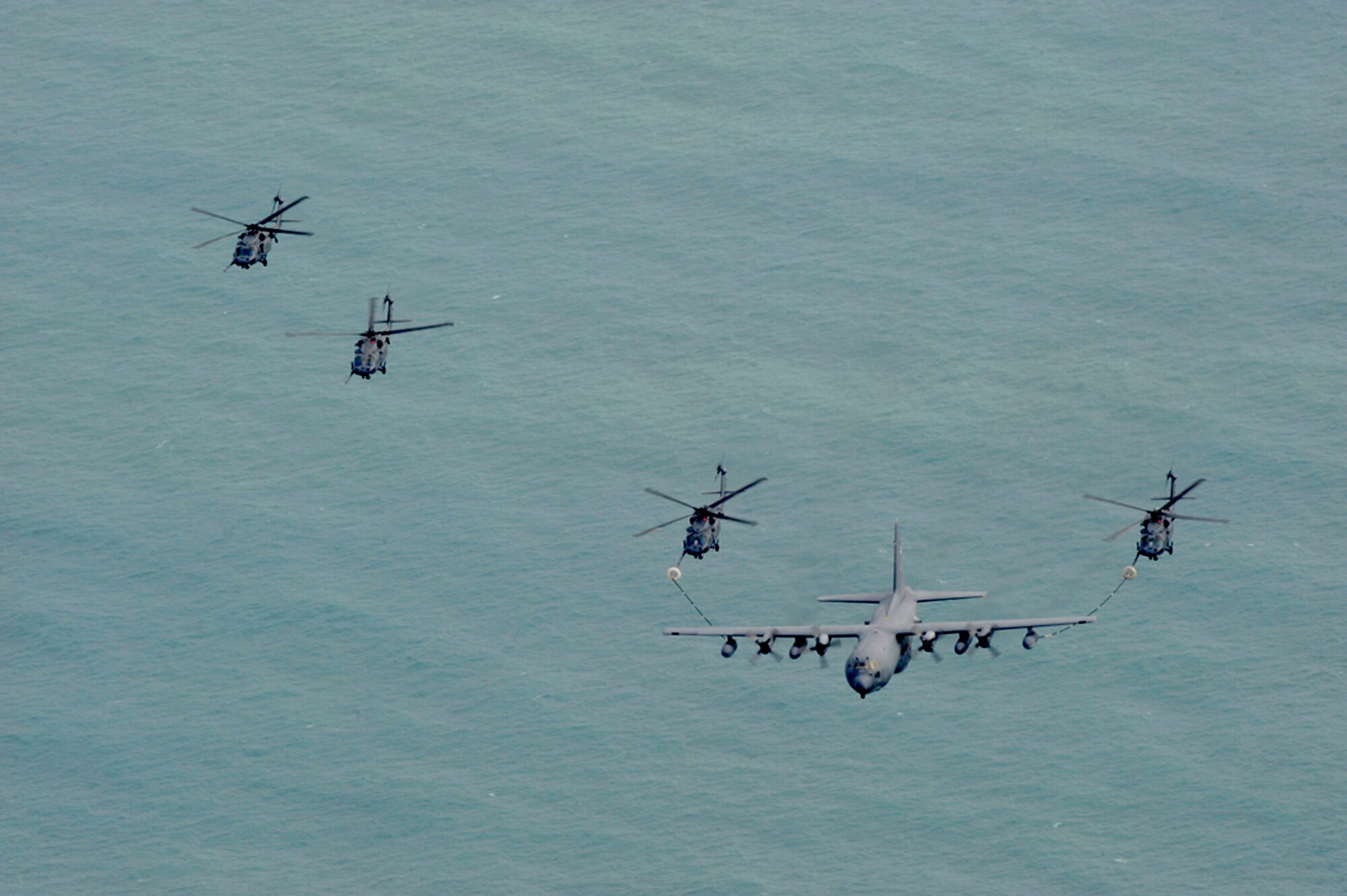 Aircraft from the Air Force Reserve's 920th Rescue Wing at Patrick Air Force Base, Fla., fly over the Atlantic Ocean March 6, 2011. Airmen launched six HH-60G Pave Hawk helicopters and three HC-130P/N King extended-range refueling aircraft during their drill training weekend. (U.S. Air Force photo/Master Sgt. Rob Grande)