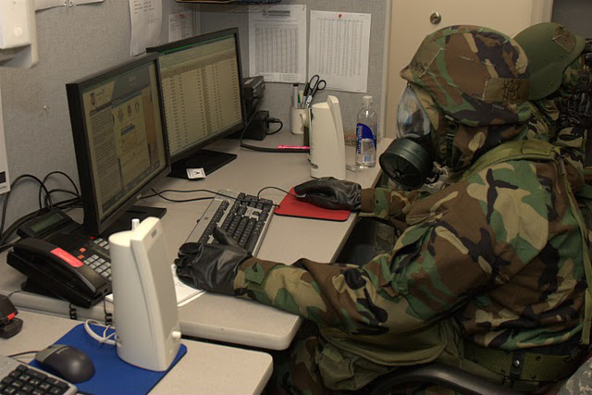 Tech. Sgt. Nickolas Houdeck, a member of the 73rd Aerial Port Squadron here, works on a computer in Mission Oriented Protective Posture gear in preparation for the operational readiness inspection the squadron participated in at the Combat Readiness Training Center, Savannah, Ga., Jan. 22 through Jan. 29 2011. The 73rd APS participated in a joint ORI with the 6th Air Mobility Wing and the 927th Air Refueling Wing, both from MacDill Air Force Base, Fla. (U.S. Air Force photo)