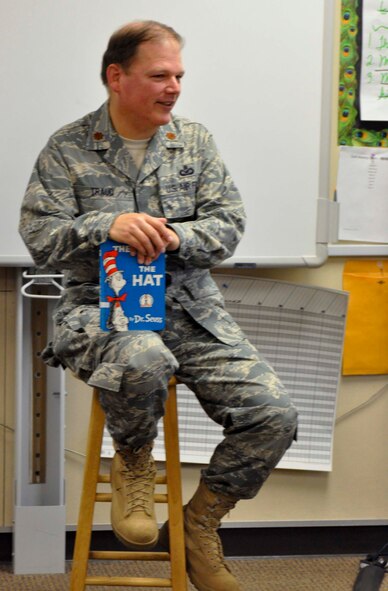 Following his reading of Dr. Seuss's "Cat in the Hat," Maj. Donald Traud speaks with sixth graders in Mrs. Gramberg's class at John F. Kennedy Elementary School in Riverside, Calif., during Read Across America Day, March 2, 2011.  Major Traud is the director of public affairs for the 452nd Air Mobility Wing at March Air Reserve Base, Calif. (U.S. Air Force photos by Megan Just)