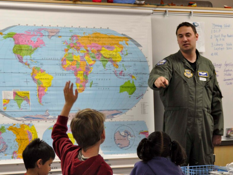 Air Force Capt. Jamie Studer responds to questions from Mrs. Baker's third grade class at John F. Kennedy Elementary School in Riverside, Calif., during Read Across America Day, March 2, 2011.  Captain Studer, is a KC-135 Stratotanker pilot with the 912th Air Refueling Squadron at March Air Reserve Base, Calif.  (U.S. Air Force photo by Megan Just)