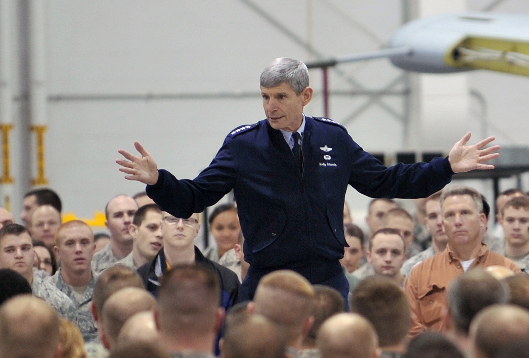 Air Force Chief of Staff Gen. Norton Schwartz replies to a question from an Airman during an all call March 8, 2011, at Whiteman Air Force Base, Mo. General Schwartz answered questions from Airmen about retirement benefits, national defense and force management. (U.S. Air Force photo/Tech. Sgt. Charles Larkin Sr.)