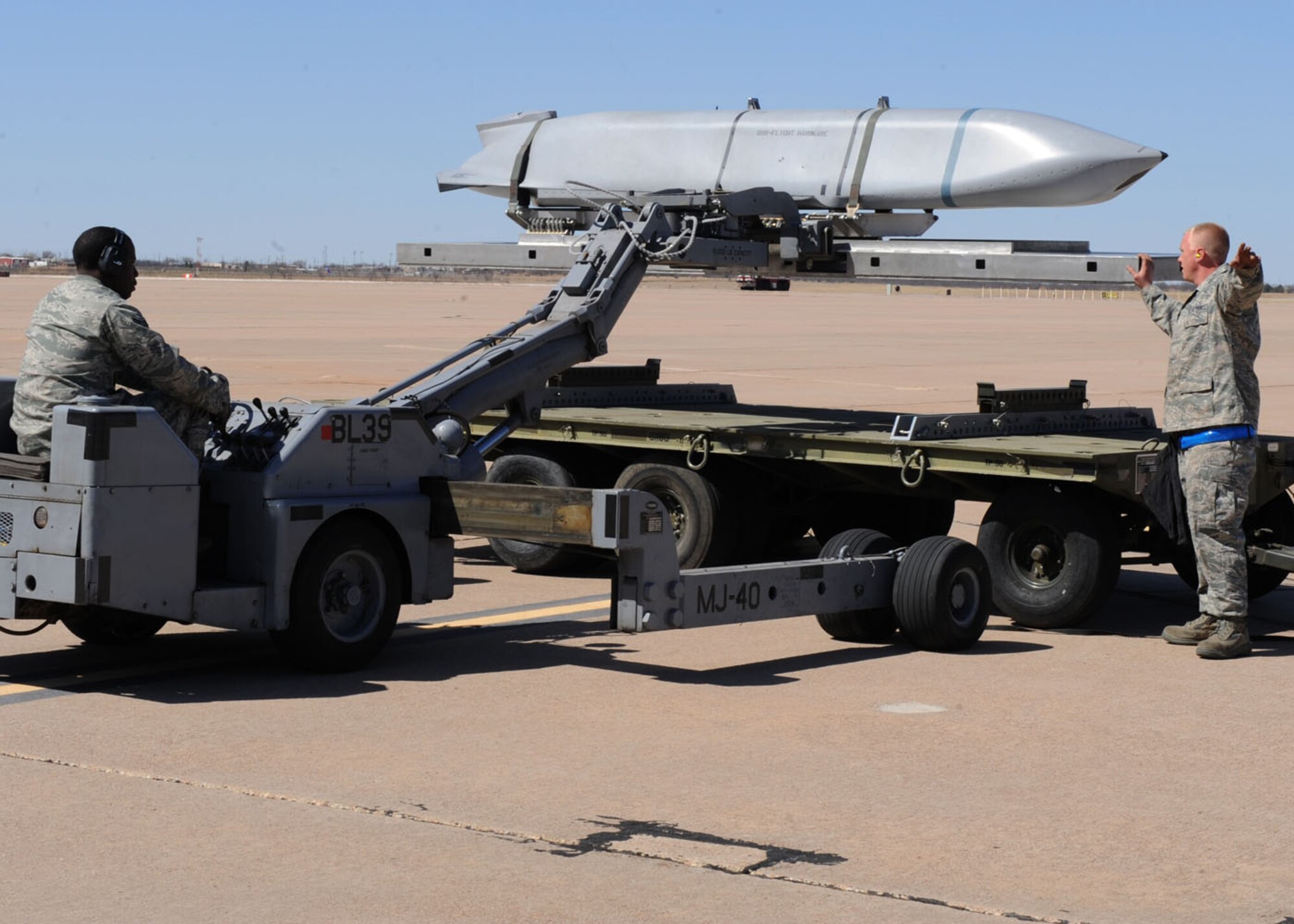 DYESS AIR FORCE BASE, Texas – Airman 1st Class Lance Beloney, 7th Maintenance Group, moves a Joint Air-to-Surface Standoff Missile to be loaded into a B-1 during a load crew competition here, March 9. The load crew competition is a timed weapons load based on safety and efficiency. The 7th Bomb Wing walked away with five of 14 trophies in last year’s first-ever Global Strike Challenge. The seven-month long competition is set to begin again in April. (U.S. Air Force photo/ Airman 1st Class Chelsea Cummings)
