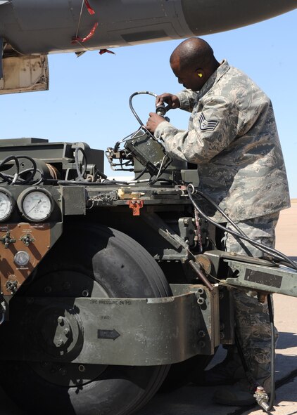 DYESS AIR FORCE BASE, Texas – Staff Sgt. Jamar Hugie, 7th Maintenance Group, prepares to load a bomb during a load crew competition here, March 9. The load crew competition is a timed weapons load based on safety and efficiency. The 7th Bomb Wing walked away with five of 14 trophies in last year’s first-ever Global Strike Challenge. The seven-month long competition is set to begin again in April. (U.S. Air Force photo/ Airman 1st Class Chelsea Cummings)