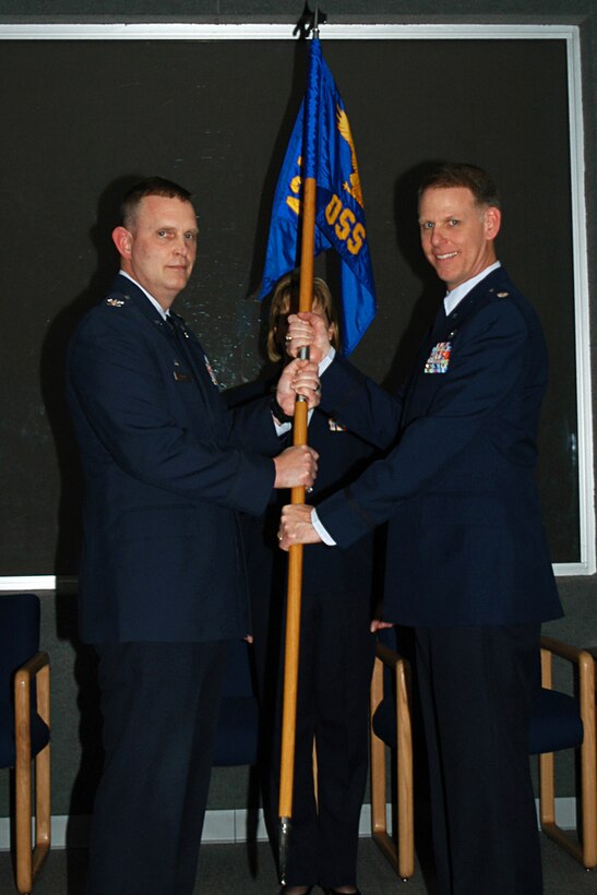 GRISSOM AIR RESERVE BASE, Ind. -- Col. William Mason, left, presents the 434th Operations Support Squadron guidon to Lt. Col. Larry Shaw as he takes command of the unit during a special ceremony held here March 5. Colonel Mason, 434th Operations Group commander, presided over the ceremony, which is steeped in military tradition and aimed allowing a unit's troops to witness a command transition. Colonel Shaw took over for Lt. Col. Todd Moody, who is now serving as the 74th Air Refueling Squadron operations officer. (U.S. Air Force photo/Capt. Kelly Howard)
