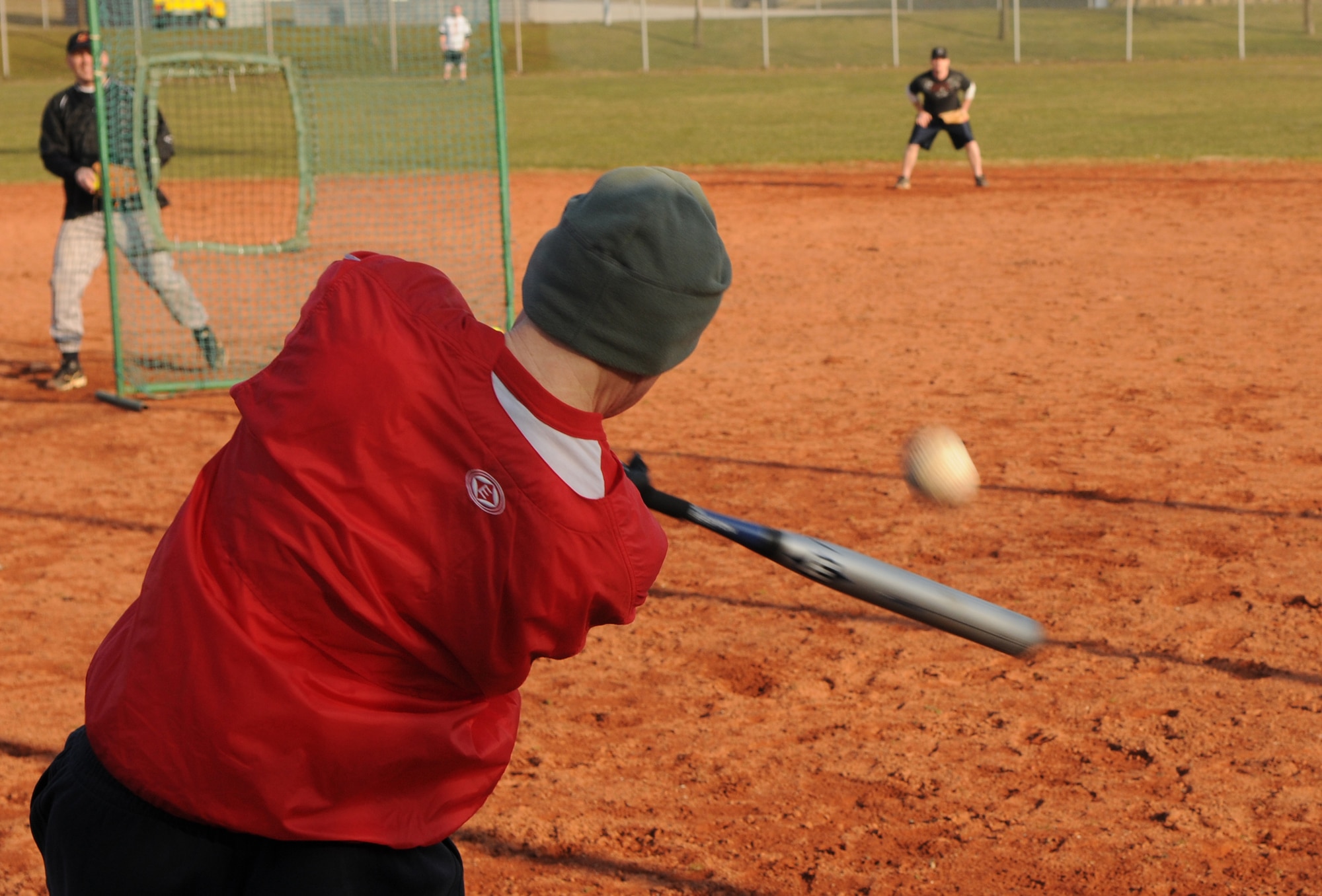 SPANGDAHLEM AIR BASE, Germany –John Allen, 606th Air Control Squadron, swings at a softball during batting practice on varsity field 1 March 8. The Spangdahlem Sabers Men’s varsity softball team is currently holding tryouts and practice until March 18. The team competes in tournaments throughout Europe, playing against other Air Force, Army, and Navy teams. (U.S. Air Force photo/Airman 1st Class Matthew B. Fredericks)