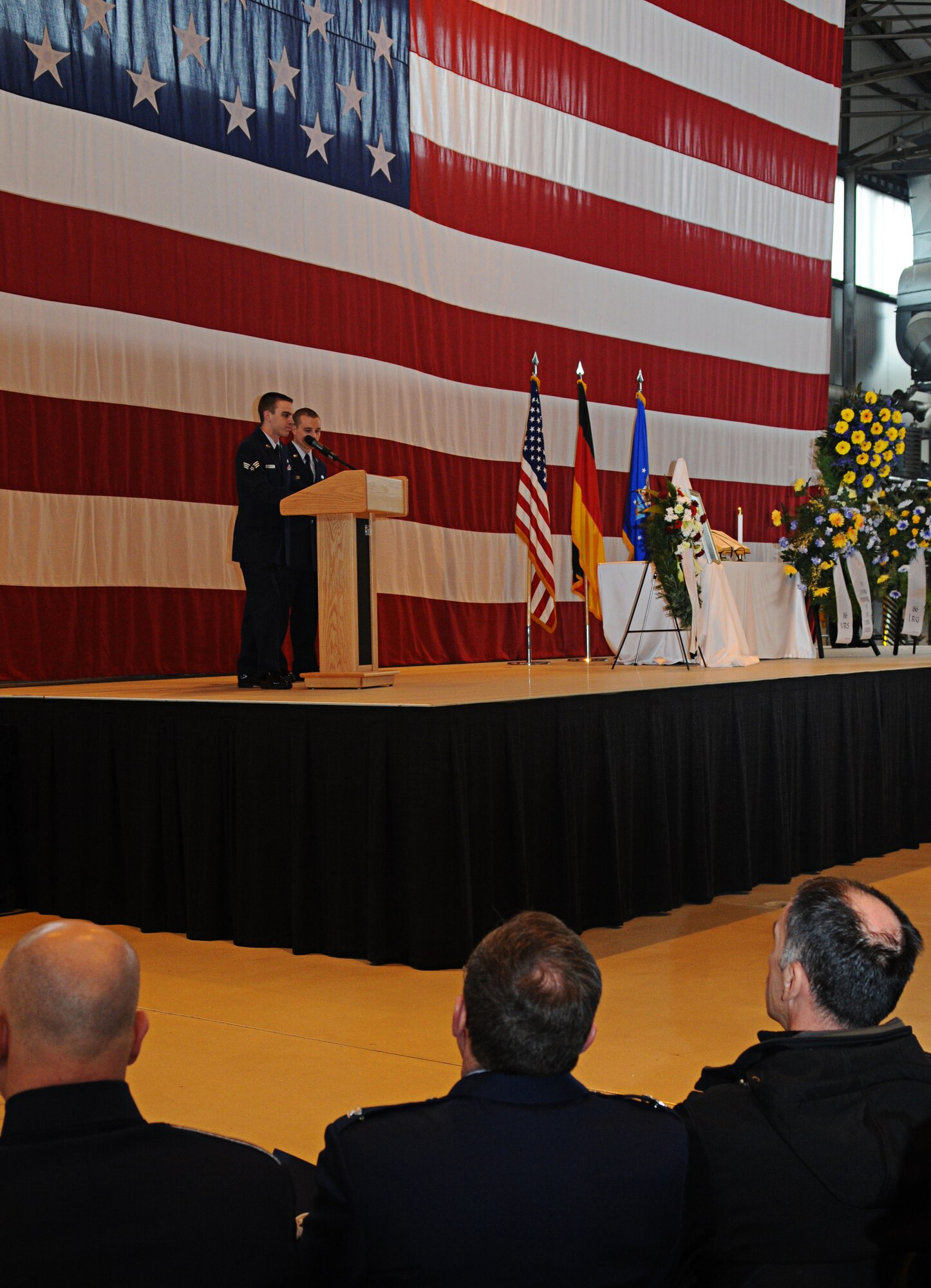 U.S. Air Force Senior Airman Bradley Opfar and Airman 1st Class Caleb Crickette, 86th Vehicle Readiness Squadron, pay tribute during the memorial service for Airman 1st Class Zachary Cuddeback, 86th Vehicle Readiness Squadron, Ramstein Air Base, Germany, March 10, 2011. Airman Cuddeback was killed in action at Frankfurt International Airport March 2, 2011. (U.S. Air Force photo by Airman 1st Class Desiree Whitney Esposito)