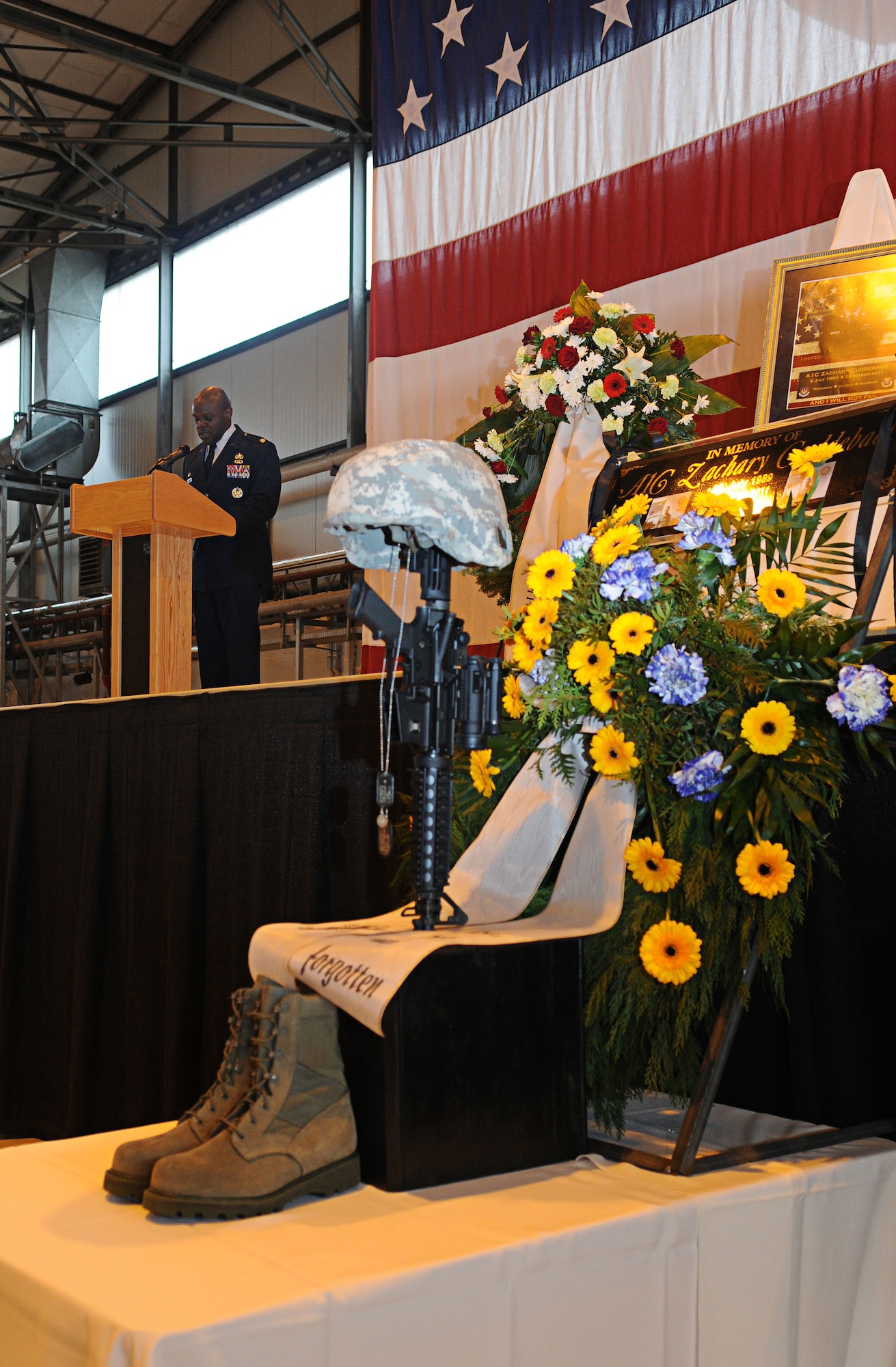 U.S. Air Force Lt. Col. Uduak Udoaka, 86th Vehicle Readiness Squadron commander, delivers his message during the memorial service for Airman 1st Class Zachary Cuddeback, 86th Vehicle Readiness Squadron, Ramstein Air Base, Germany, March 10, 2011. Airman Cuddeback was killed in action at Frankfurt International Airport March 2, 2011. (U.S. Air Force photo by Airman 1st Class Desiree Whitney Esposito) 