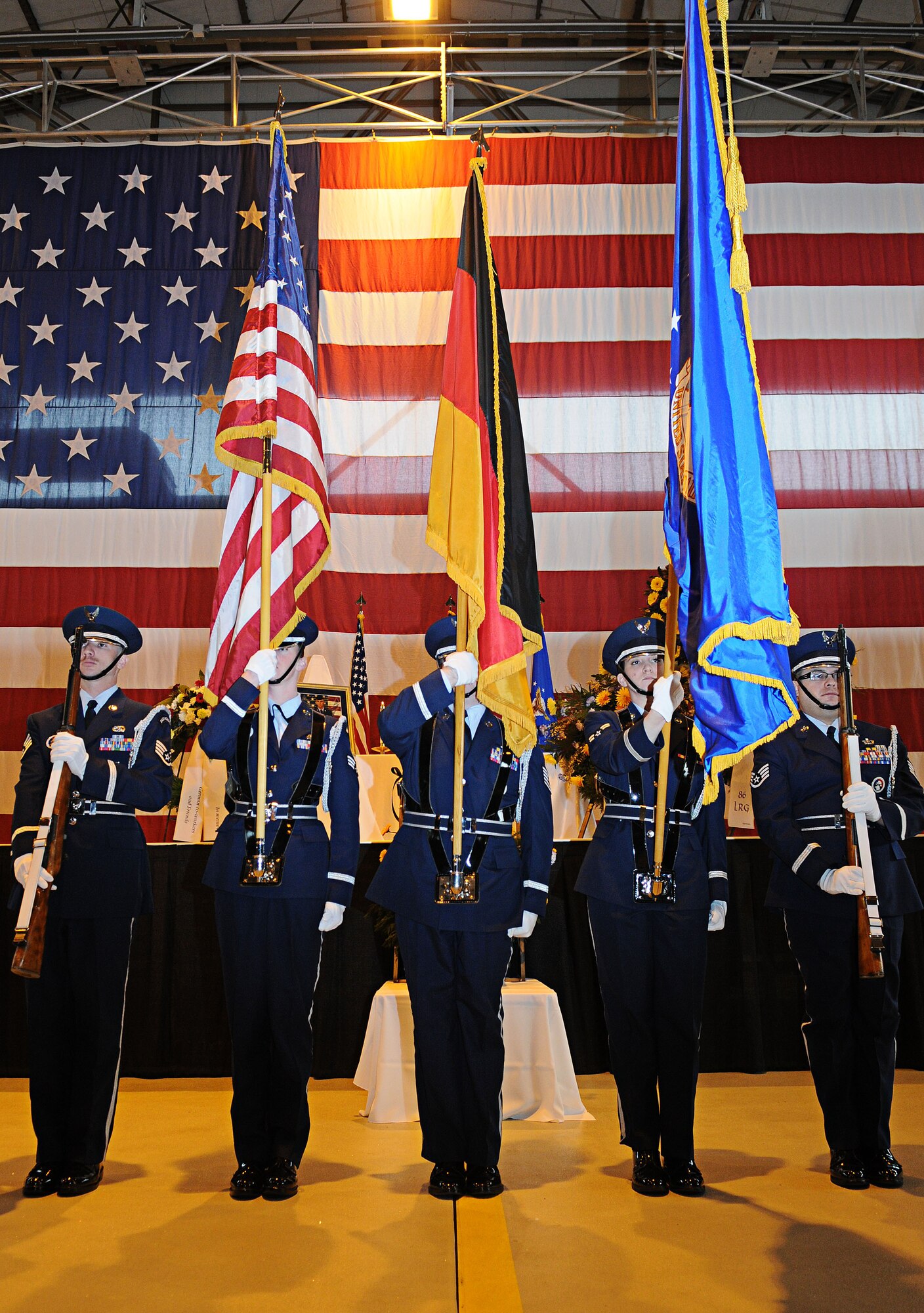 U.S. Air Force Ramstein Air Base Honor Guard posts the colors during the memorial service for Airman 1st Class Zachary Cuddeback, 86th Vehicle Readiness Squadron, Ramstein Air Base, Germany, March 10, 2011. Airman Cuddeback was killed in action at Frankfurt International Airport March 2, 2011.  (U.S. Air Force photo by Airman 1st Class Desiree Whitney Esposito)