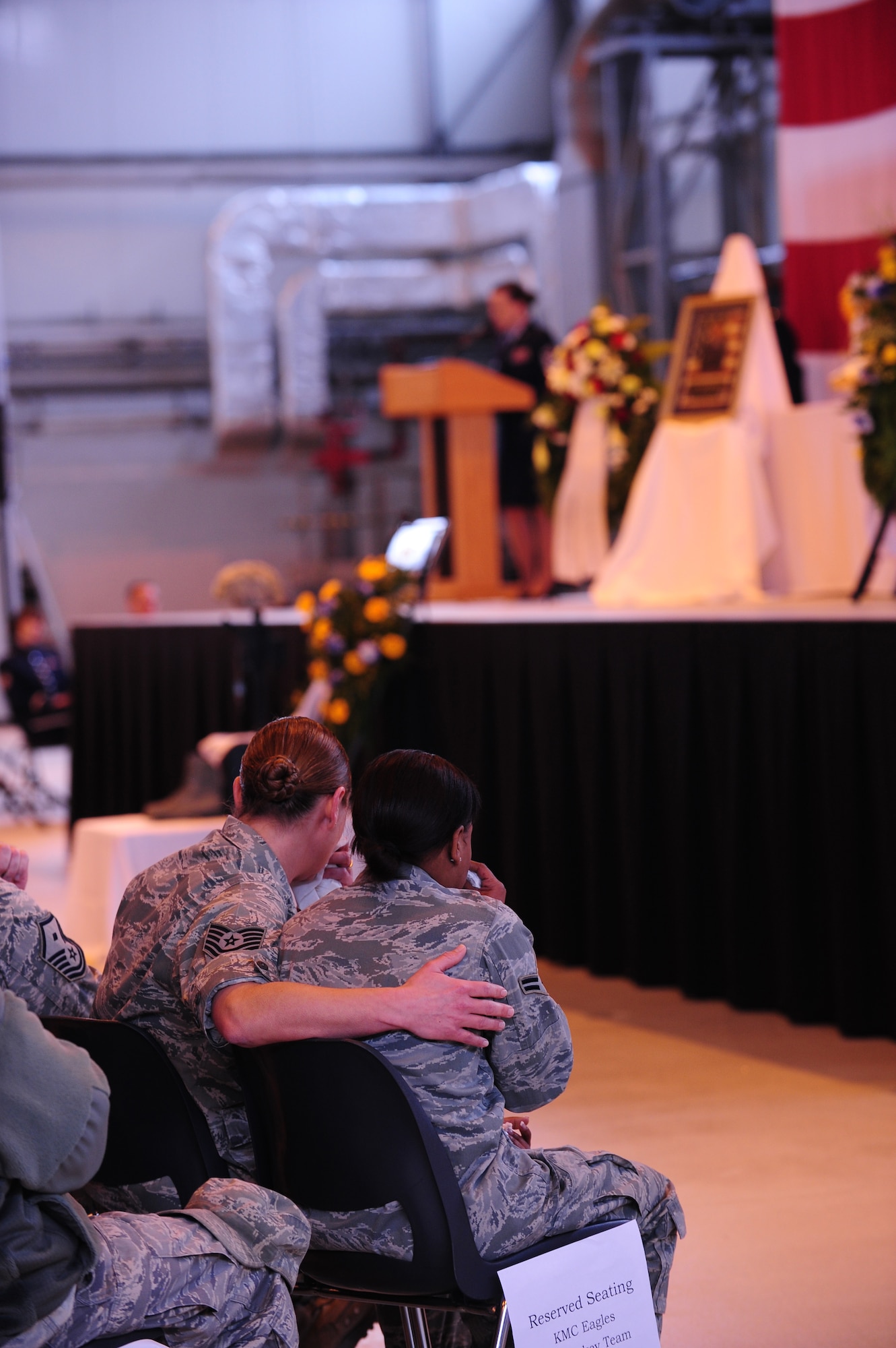 Airmen mourn during a memorial ceremony for Airman 1st Class Zachary Cuddeback, 86th Vehicle Readiness Squadron, Ramstein Air Base, Germany, March 10, 2011. Airman Cuddeback was killed in action at Frankfurt International Airport March 2, 2011. (U.S. Air Force photo by Senior Airman Brittany Perry)