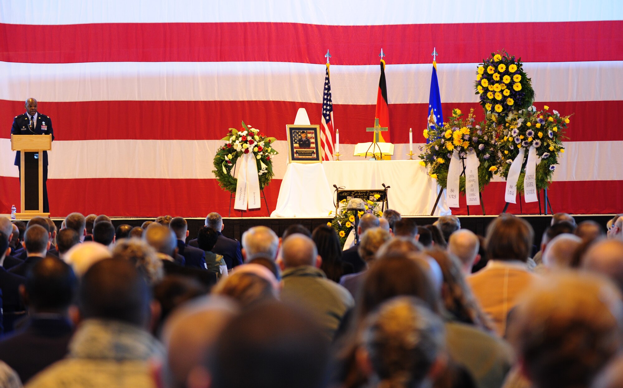 U.S. Air Force Lt. Col. Uduak Udoaka, 86th Vehicle Readiness Squadron commander, delivers his message during a memorial ceremony for Airman 1st Class Zachary Cuddeback, 86th VRS, Ramstein Air Base, Germany, March 10, 2011. Airman Cuddeback was killed in action at Frankfurt International Airport March 2, 2011. (U.S. Air Force photo by Senior Airman Brittany Perry)