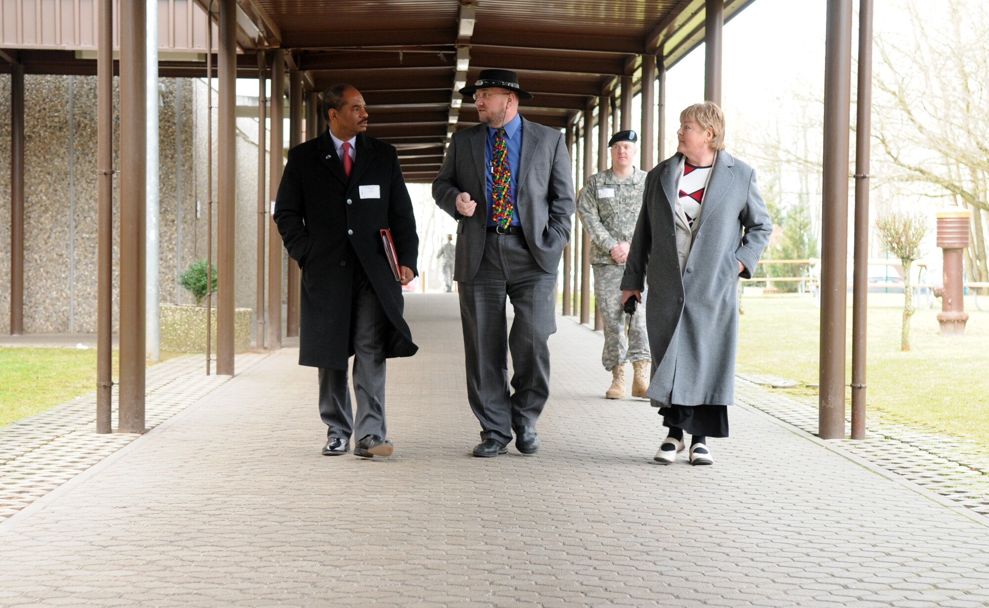 SPANGDAHLEM AIR BASE, Germany – Robert L. Gordon III, left, deputy assistant secretary of defense for military community and family policy, speaks with Spangdahlem Elementary School Principal Richard R. Alix, center, and Assistant Principal Marsha Swanson during his visit here March 9. Mr. Gordon visited the 52nd Fighter Wing to better understand programs available to family members and community programs on base. (U.S. Air Force photo/Senior Airman Nathanael Callon)