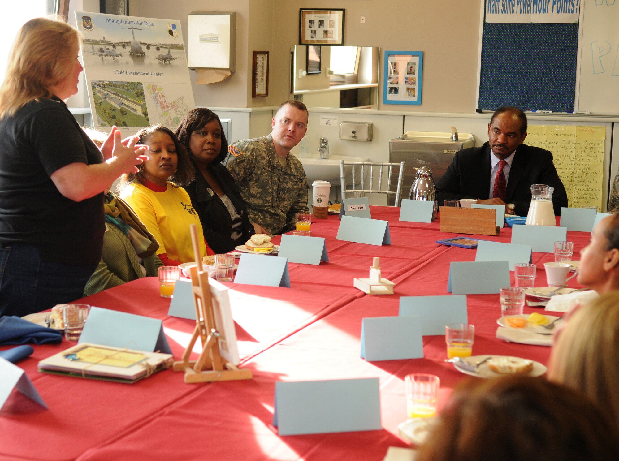 SPANGDAHLEM AIR BASE, Germany – Marjorie Egger, Spangdahlem Air Base school’s sports coordinator, explains various sports programs available to children to Robert L. Gordon III, deputy assistant secretary of defense for military community and family policy, during his visit here March 9. Mr. Gordon visited the 52nd Fighter Wing to better understand programs available to family members and community programs on base. (U.S. Air Force photo/Senior Airman Nathanael Callon)