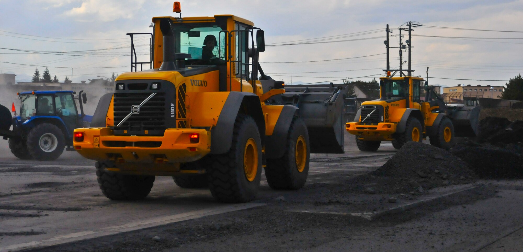 YOKOTA AIR BASE, Japan – Personnel assigned to the 374th Civil Engineer Squadron, horizontal construction office, work to repair damage to the airfield following an simulated explosion during an Operational Readiness Exercise here March 10. The “Dirt Boyz” as this team is often referred to as, were tasked to fix the damage so that aircraft flight operations could continue. (U.S. Air Force photo /Airman 1st Class Krystal M. Garrett)
