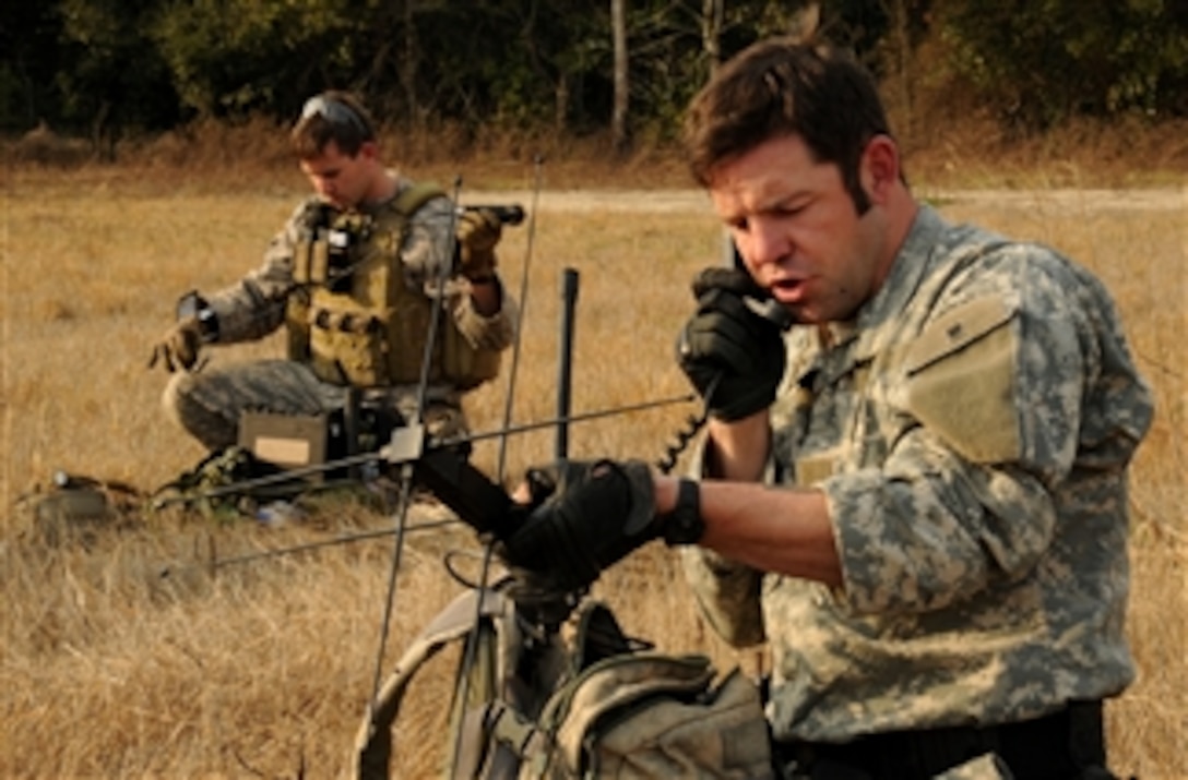 U.S. Army soldiers assigned to the 4th Battalion, 10th Special Forces Group call in an operation schedule during Emerald Warrior 2011 in Tallahassee, Fla., on March 2, 2011.  Emerald Warrior is an annual two-week joint/combined tactical exercise sponsored by U.S. Special Operations Command to provide realistic training opportunities to conventional and special operations forces.  