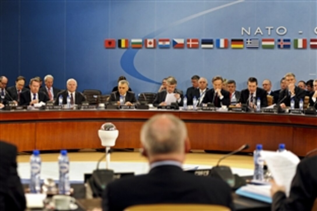 U.S. Defense Secretary Robert M. Gates, sixth from left, attends the first session of NATO defense ministers meetings at NATO headquarters in Brussels, Belgium, March 10, 2011.