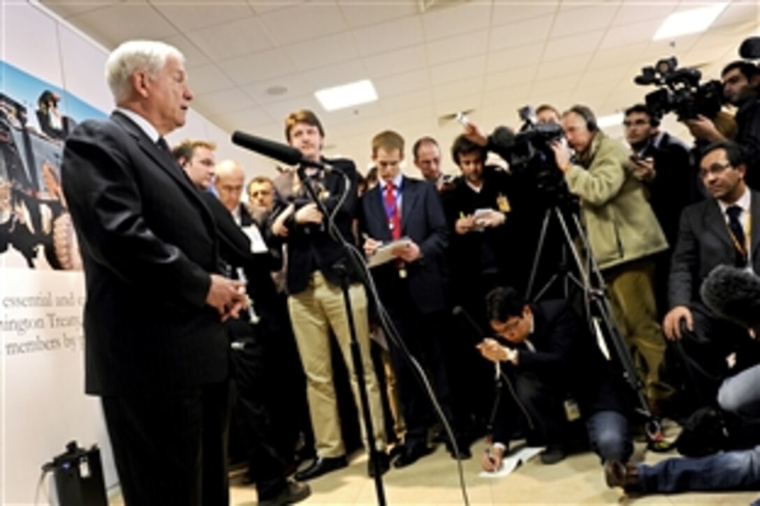 U.S. Defense Secretary Robert M. Gates speaks with members of the press following a meeting of defense ministers at NATO headquarters in Brussels, Belgium, March 10, 2011.