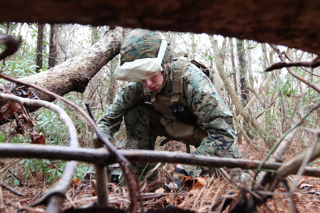 Corporal Timothy Dorsey, a sensor surveillance operator with the 22nd Marine Expeditionary Unit, carefully covers surveillance equipment during an operational check aboard Marine Corps Base Camp Lejeune, N.C., March 10, 2010. This equipment will survey areas of interest during the MEU's upcoming deployment. The Marine and sailors of the 22nd MEU are currently participating in their pre-deployment training program, which is a series of progressively complex exercises designed to train and test the MEU's ability to operate as a cohesive and effective Marine Air Ground Task Force.