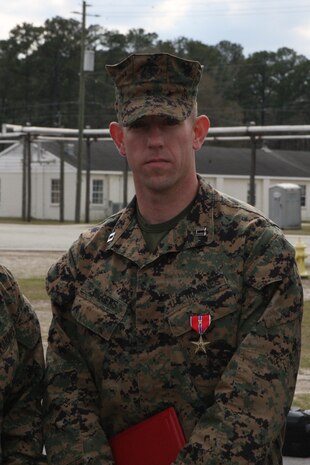 Capt. Joshua Biggers, executive officer of the Infantry Training Battalion, School of Infantry – East, stands after receiving the Bronze Star Medal with V following his award ceremony aboard Camp Geiger, March 11. As commanding officer of Company K, 3rd Battalion, 6th Marine Regiment, Regimental Combat Team 7, 1st Marine Division (Forward), in Marjah, Afghanistan, Biggers displayed multiple acts of heroism in leading his Marines and sailors during the six-month Operation Moshtarak.