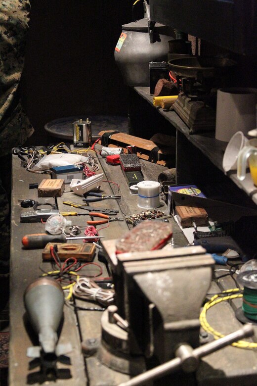 One of the training modules within the Mobile Counter-IED Interactive Trainer resembles the inside of an Afghan bomb maker’s residence. Interactive displays include a workbench, a bomb “cooking” station and component hiding places.