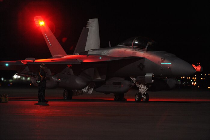 NELLIS AIR FORCE BASE, Nev., --  U.S Navy EA-18G Growler From VAQ-138 Squadron, prepares to taxi onto the Nellis Air Force Base, Nev., runway during Red Flag 11-3 March 10. Red Flag is a realistic combat training exercise involving the air forces of the United States and its allies.  The exercise is hosted north of Las Vegas on the Nevada Test and Training Range. (U.S. Air Force Photo by Airman1st Class Daniel Hughes)