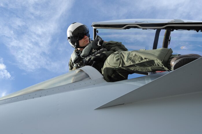 NELLIS AIR FORCE BASE, Nev., --  U.S Navy Lt. Rodrigo Simoes, VAQ-138 Squadron pilot, steps into the cockpit of a EA-18G Growler before a training mission during Red Flag 11-3 Nellis Air Force Base Nev.,March 10. Red Flag is a realistic combat training exercise involving the air forces of the United States and its allies.  The exercise is hosted north of Las Vegas on the Nevada Test and Training Range. (U.S. Air Force Photo by Airman1st Class Daniel Hughes)