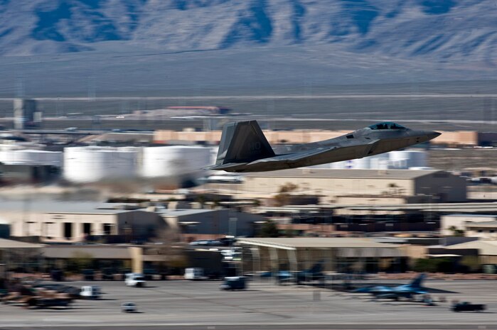 NELLIS AIR FORCE BASE, Nev., --  F-22 Raptor, 49th Fighter Wing, Holloman Air Force Base, N.M., departs for a training mission over the Nevada Test and Training Range during Red Flag 11-3 at Nellis Air Force Base, Nev., March 8. Red Flag is a realistic combat training exercise involving the air forces of the United States and its allies. The exercise is hosted north of Las Vegas on the Nevada Test and Training Range.(U.S. Air Force photo by Senior Airman Brett Clashman)