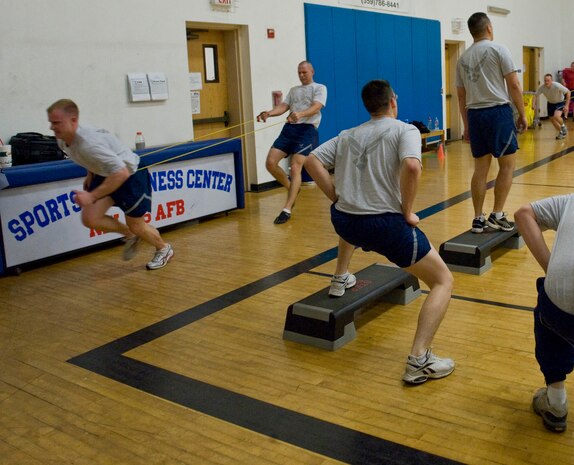 NELLIS AIR FORCE BASE, Nev.-- Members of Airmen Leadership School class 11-D cycle through several different exercises at the Nellis fitness center. Over the past year, Nellis ALS instructors have been developing a comprehensive, constantly-changing physical training program to greatly improve the physical fitness of their students. (U.S. Air Force photo by Airman 1st Class Jamie Nicley)