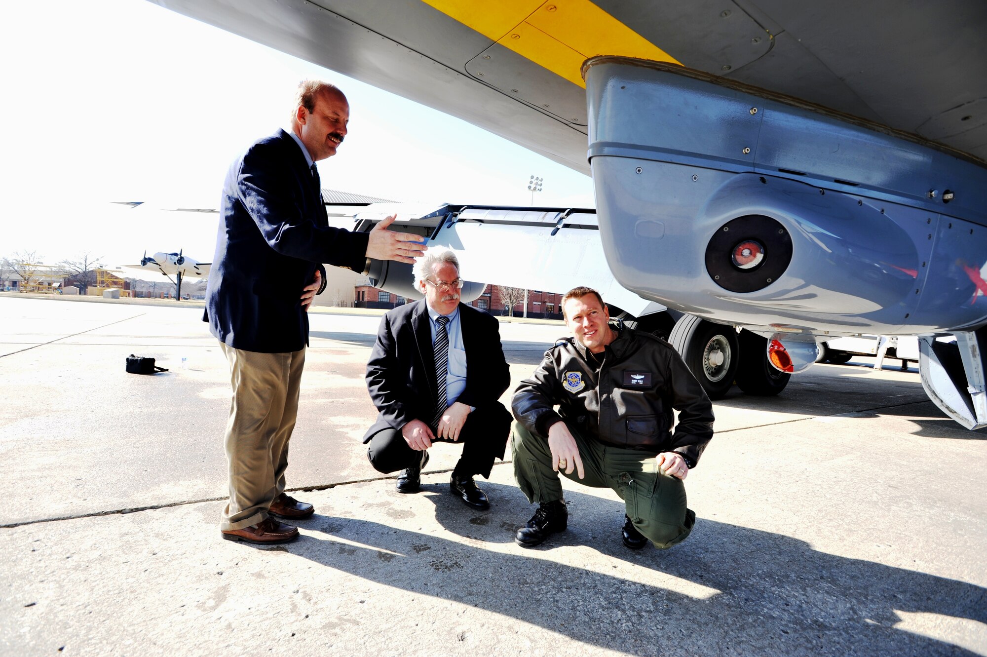 Mr. James Shilling, Large Aircraft Infrared Countermeasures, or LAIRCM, system manager for Northrop-Grumman in Chicago, Mr. Raymond Berhalter, program manager at the KC-135 System Program Office at Tinker AFB, Okla., and Lt. Col. Randall Sealy, tanker test manager and chief of Headquarters Air Mobility Command’s Aircraft Test Management Branch -- part of AMC’s Test and Evaluation Division, look at a LAIRCM pod attached to a KC-135 Stratotanker parked on the flightline March 1, 2011, at Scott Air Force Base, Ill.  In a combined effort between Air Mobility Command, the Air National Guard, the KC-135 Program Office, Northrop-Grumman and other agencies, a KC-135 LAIRCM pod defensive system is becoming a reality. The pod, called the Guardian System by maker Northrop-Grumman, is a laser-based countermeasures system designed to detect, provide warning of, and employ countermeasures against infrared-guided surface-to-air missiles. (U.S. Air Force Photo/Master Sgt. Scott T. Sturkol)