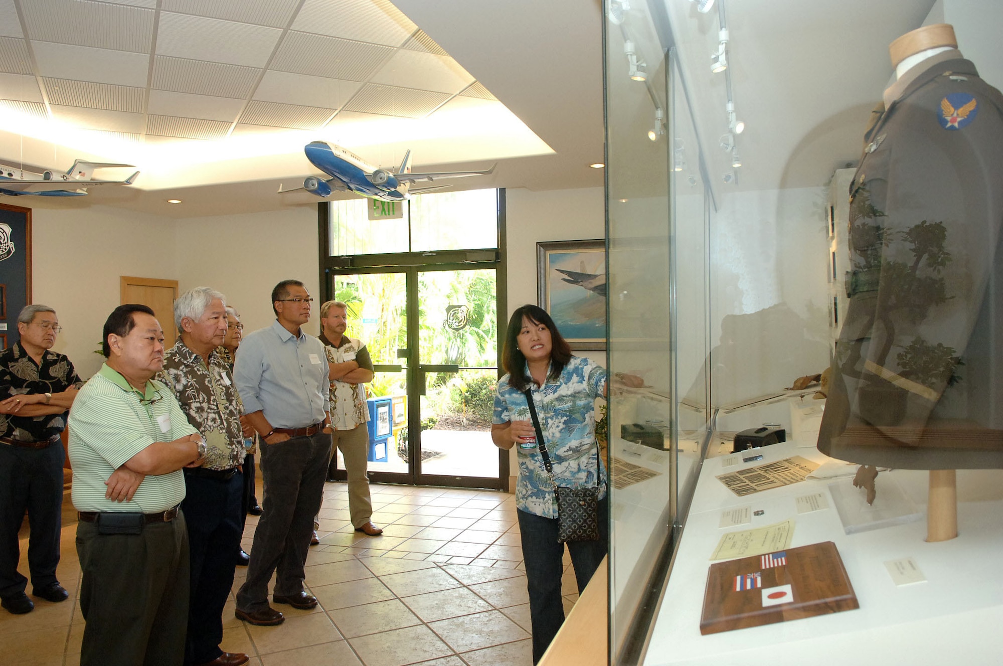 Jessie Higa, a volunteer historian for the base, gives a tour of the 15th Wing headquarters building to members of the Friends of Hickam community group Mar. 10 at Joint Base Pearl Harbor-Hickam, Hawaii. The Friends of Hickam are local community representatives who serve as facilitators between the 15th Wing and the Hawaiian community and seek to support, promote and foster strong community relations with 15th Wing leaders. (Photo by David D. Underwood, Jr.)