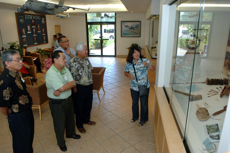 Jessie Higa, a volunteer historian for the base, gives a tour of the 15th Wing headquarters building to members of the Friends of Hickam community group Mar. 10 at Joint Base Pearl Harbor-Hickam, Hawaii. The Friends of Hickam are local community representatives who serve as facilitators between the 15th Wing and the Hawaiian community and seek to support, promote and foster strong community relations with 15th Wing leaders. (Photo by David D. Underwood, Jr.)