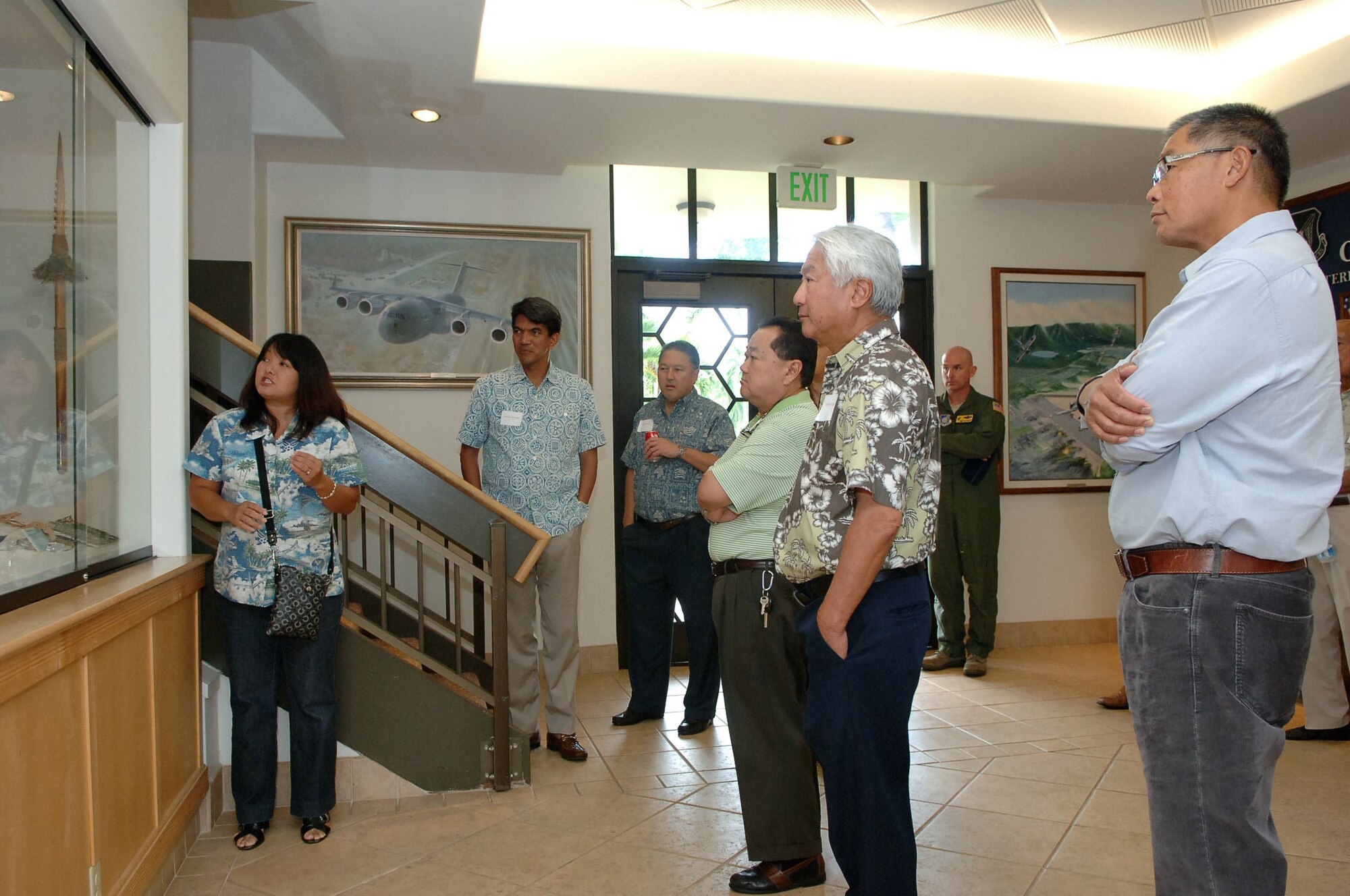 Jessie Higa, a volunteer historian for the base, gives a tour of the 15th Wing headquarters building to members of the Friends of Hickam community group Mar. 10 at Joint Base Pearl Harbor-Hickam, Hawaii. The Friends of Hickam are local community representatives who serve as facilitators between the 15th Wing and the Hawaiian community and seek to support, promote and foster strong community relations with 15th Wing leaders. (Photo by David D. Underwood, Jr.)